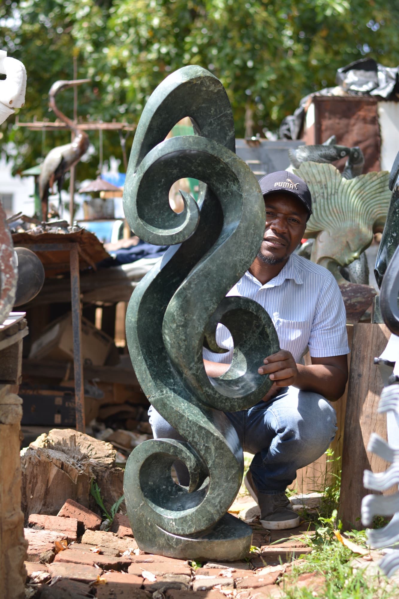 Hand-carved Shona stone sculpture from Zimbabwe — serpentine and springstone African art carved from a single block
